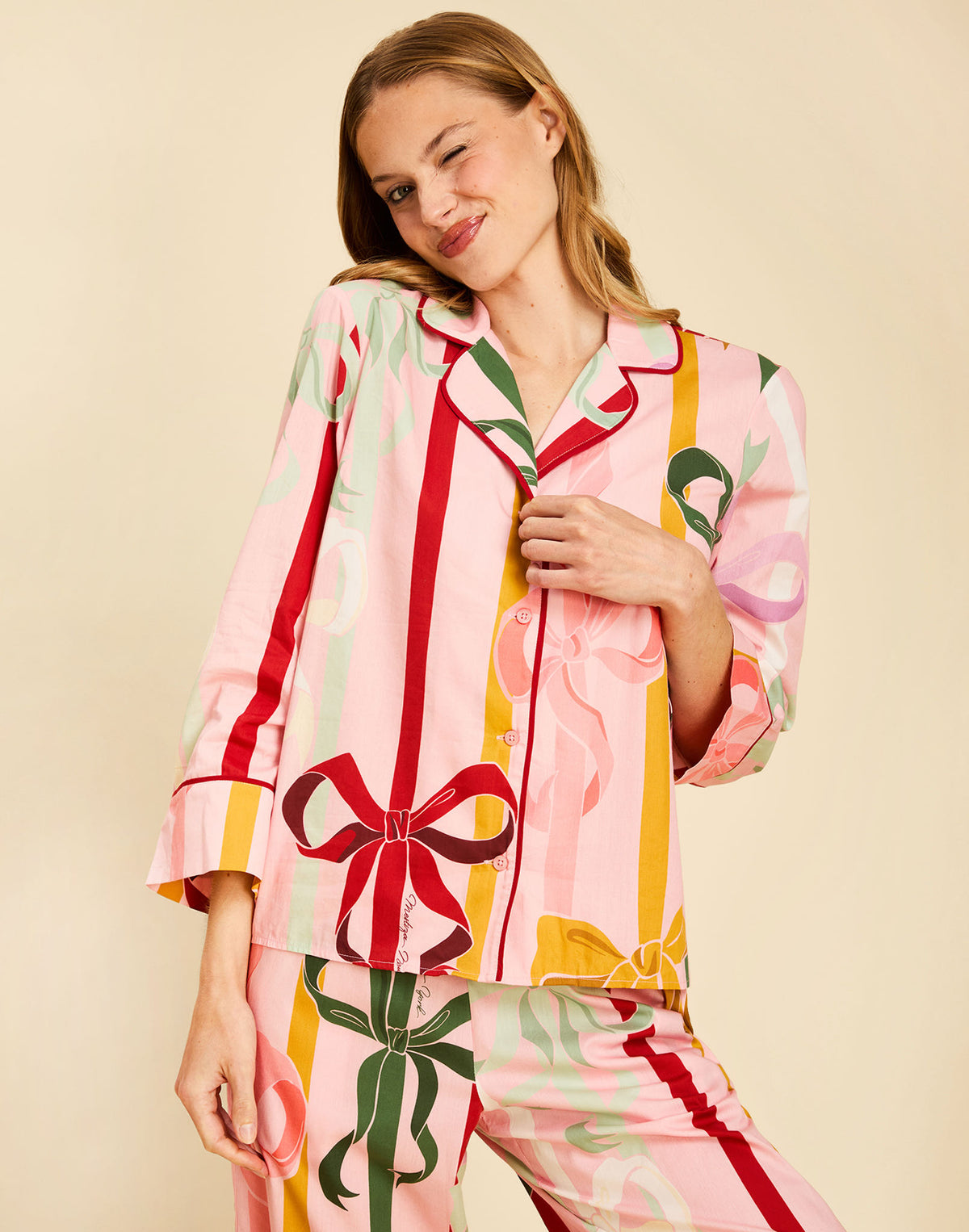 Gigi Bow Print Pajamas in Wrapped Bows with a button-front top, contrast piping, and relaxed full-length pant.