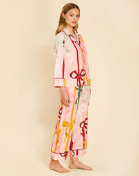 Gigi Bow Print Pajamas in Wrapped Bows with a button-front top, contrast piping, and relaxed full-length pant.