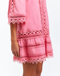 Rose pink linen A-line dress with scalloped lace on hemlines, ruffled seams and hand pockets on sides. 