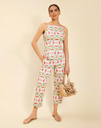 Woman wearing the Mestiza Havana Top in Quatrefoil Sierra print, featuring a bib-neck silhouette, fitted waist, princess seaming, and thin shoulder straps in crisp cotton poplin.