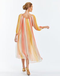 Ombre chiffon midi length cocktail dress with puff-sleeves. Self-tied straps with gold beaded tassels and side pockets. 