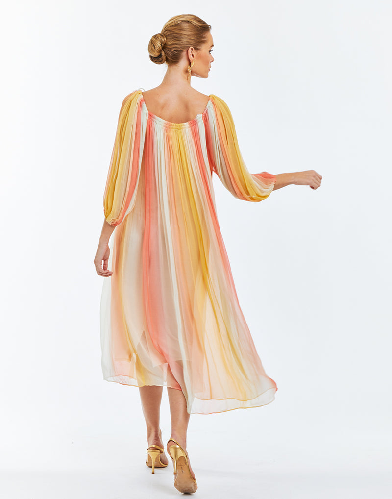 Ombre chiffon midi length cocktail dress with puff-sleeves. Self-tied straps with gold beaded tassels and side pockets. 