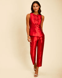Palau Cigarette Pant in Merlot Red with a high waist, pressed front pleats, and cropped slim-fit silhouette