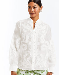 Linen blouse with full length bishop sleeves, functional buttons, and embroidered flourishes. 