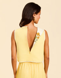 Imogen Convertible Scalloped Vest in Sunrise Meadows linen with scalloped edges, frog tie closures, and reversible yellow side.