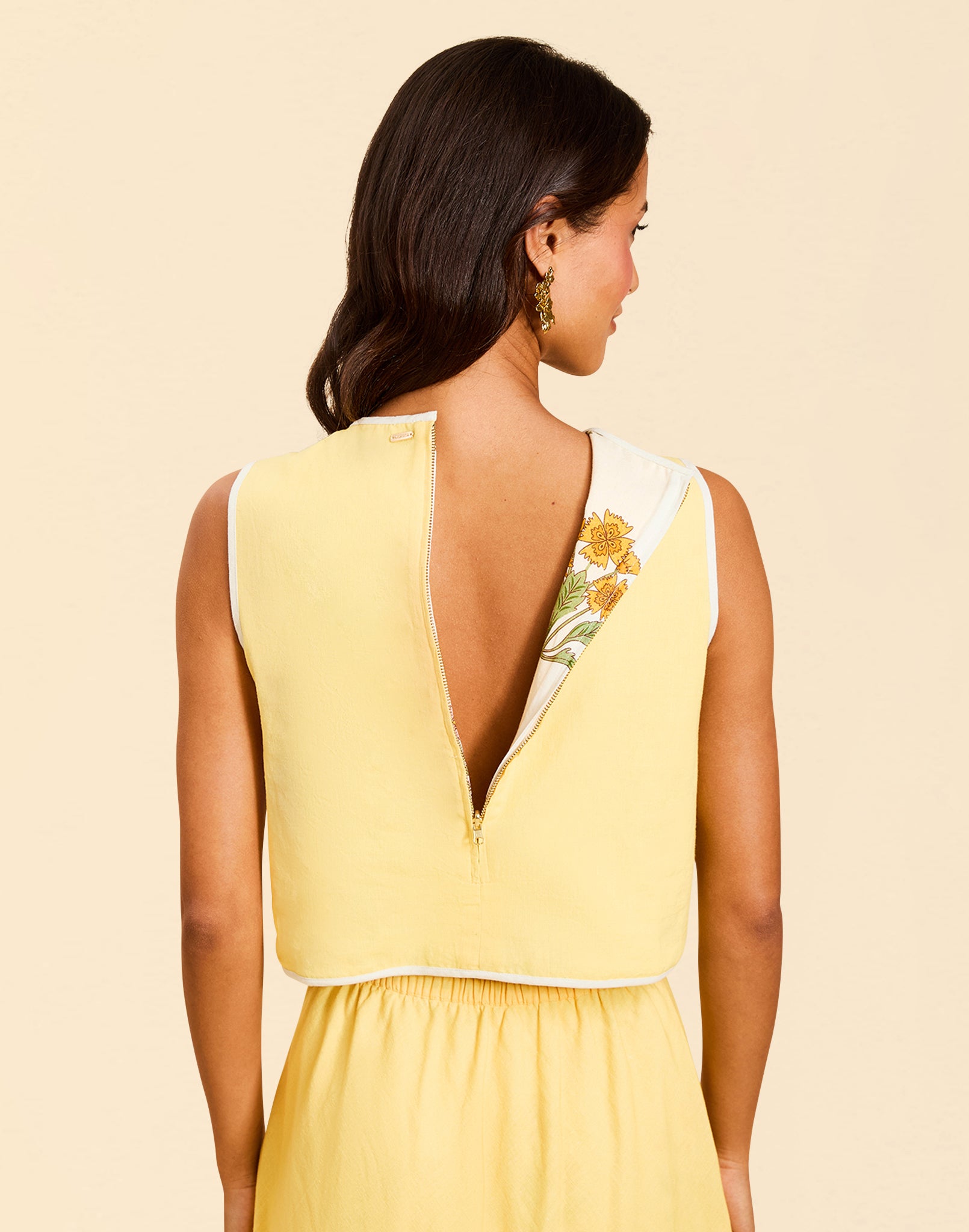 Imogen Convertible Scalloped Vest in Sunrise Meadows linen with scalloped edges, frog tie closures, and reversible yellow side.