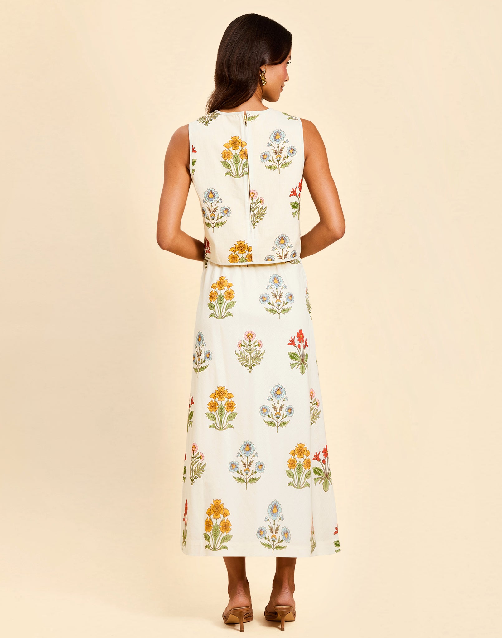 Imogen Convertible Scalloped Vest in Sunrise Meadows linen with scalloped edges, frog tie closures, and reversible yellow side.