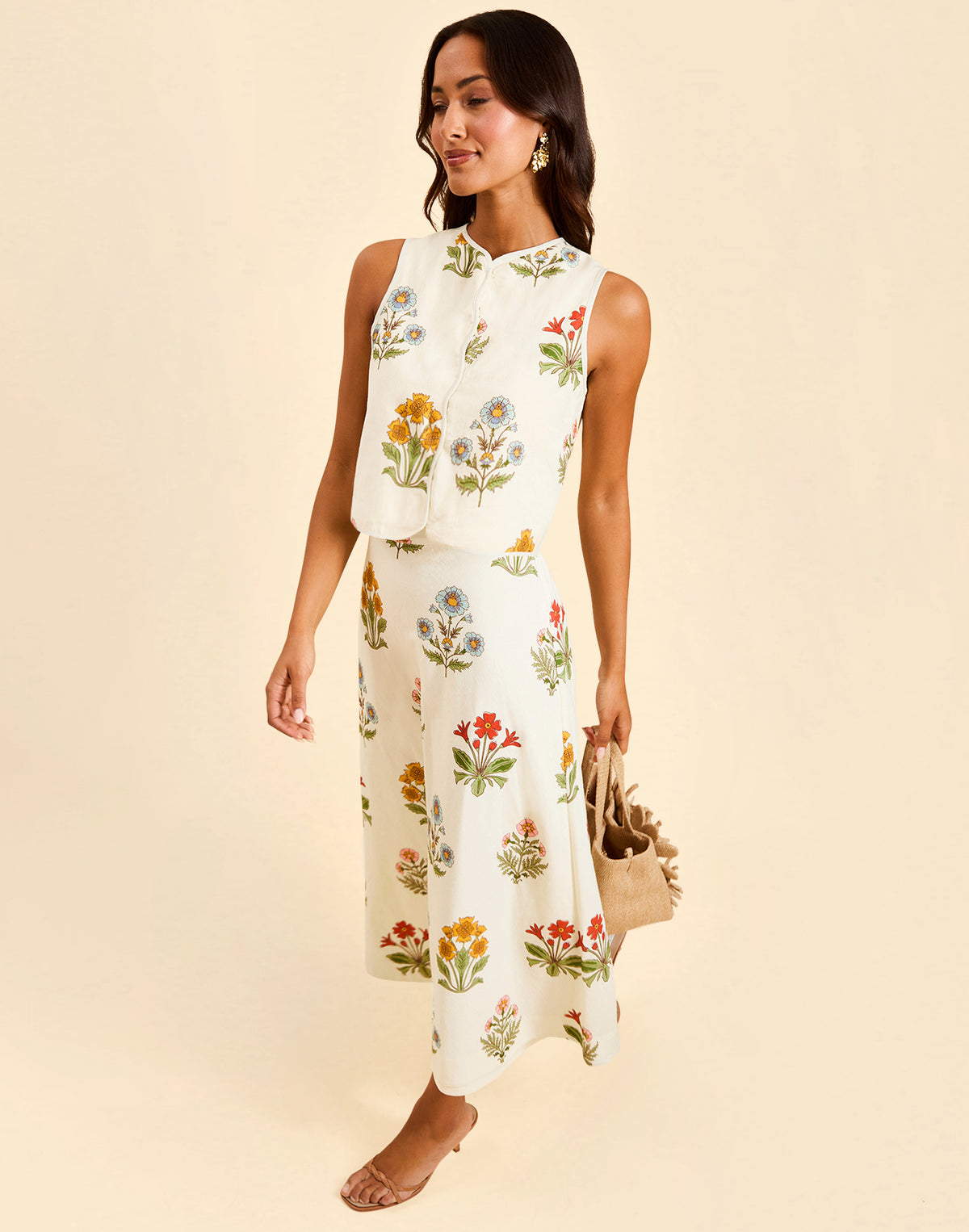 Imogen Convertible Scalloped Vest in Sunrise Meadows linen with scalloped edges, frog tie closures, and reversible yellow side.