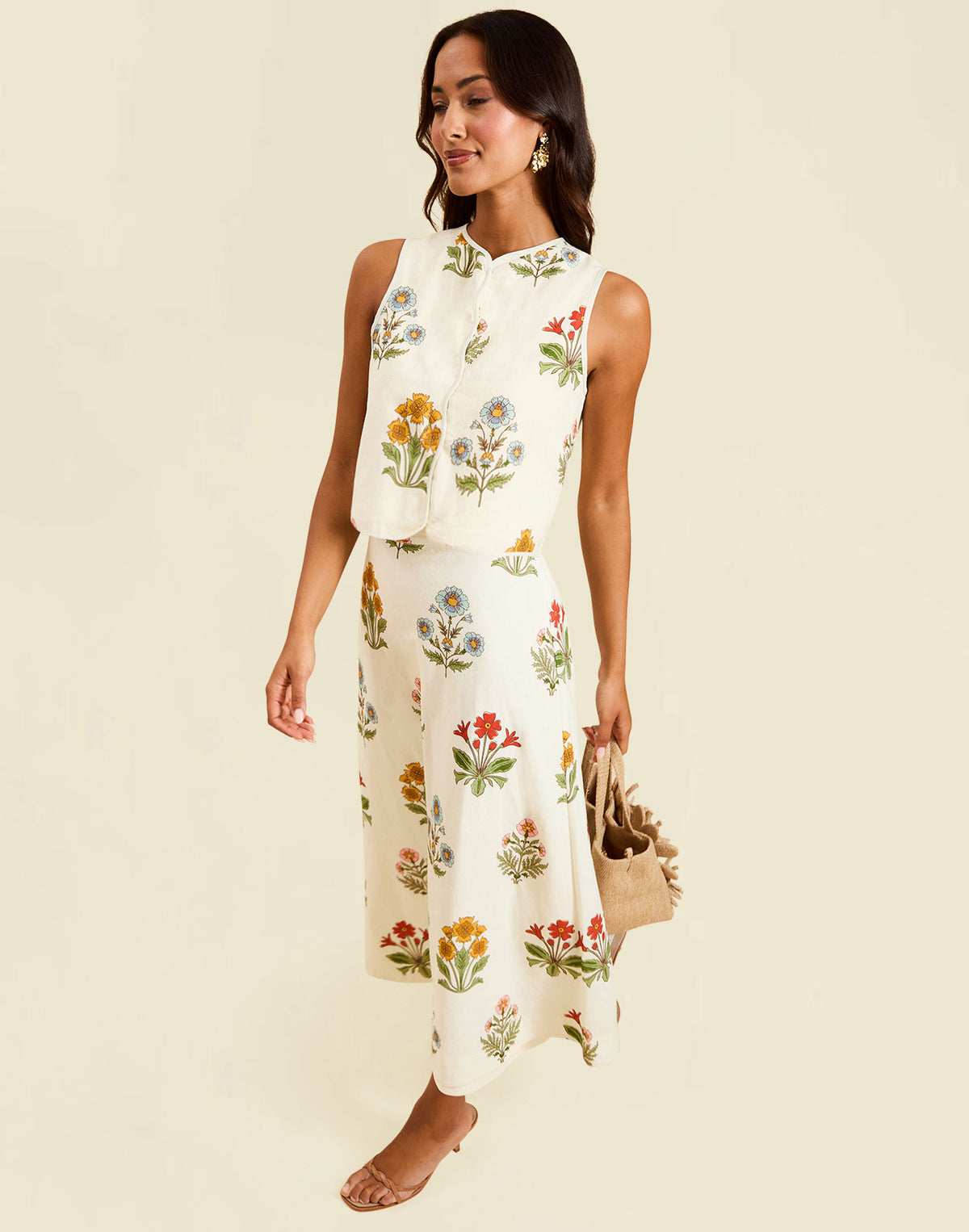 Imogen Convertible Scalloped Vest in Sunrise Meadows linen with scalloped edges, frog tie closures, and reversible yellow side.