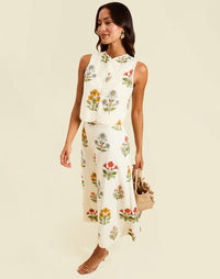 Imogen Convertible Scalloped Vest in Sunrise Meadows linen with scalloped edges, frog tie closures, and reversible yellow side.