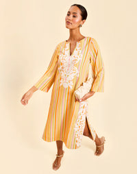 Ines Midi Caftan in Sunset Ribbons linen with embroidery detail, djellaba collar, bell sleeves, and column silhouette.
