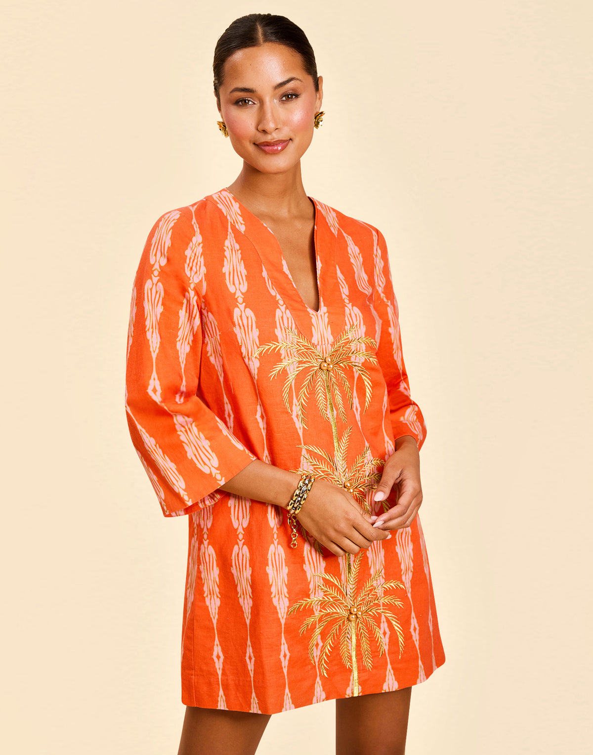 Ines Caftan Mini Dress in Hibiscus Mosaic linen with embroidered palm details, djellaba collar, and relaxed caftan silhouette.