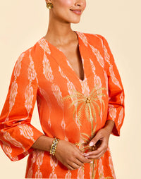 Ines Caftan Mini Dress in Hibiscus Mosaic linen with embroidered palm details, djellaba collar, and relaxed caftan silhouette.
