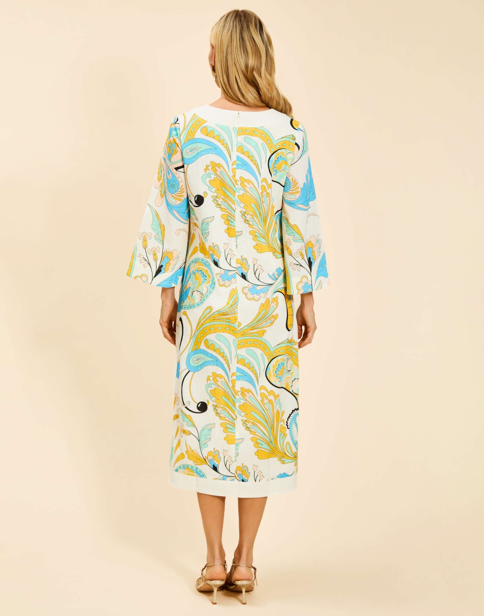 Ines Midi Caftan in Marble Rhapsody with Djellaba-style neckline, relaxed sleeves, side slits, and functional hand pockets.