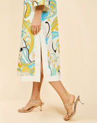 Ines Midi Caftan in Marble Rhapsody with Djellaba-style neckline, relaxed sleeves, side slits, and functional hand pockets.