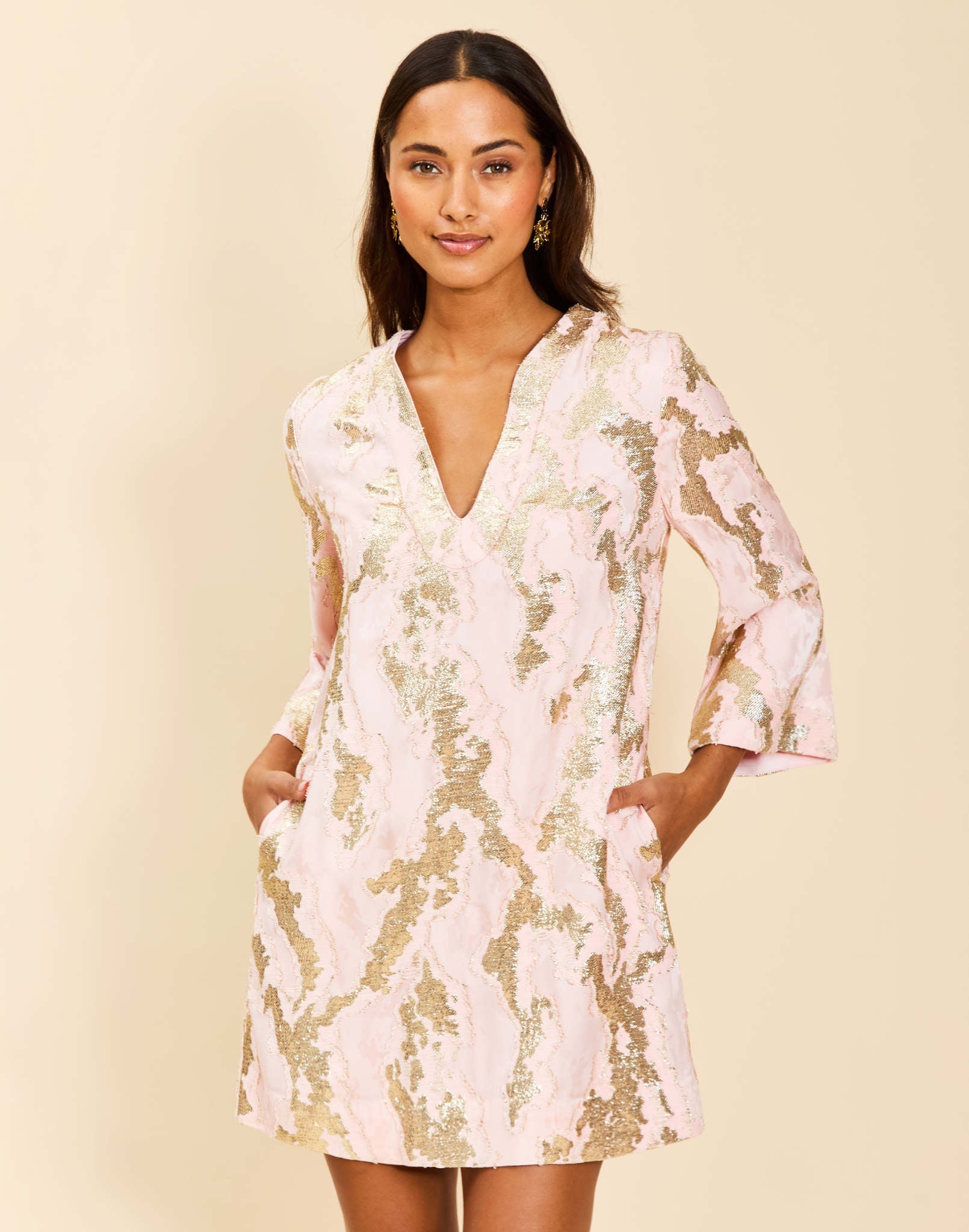Ines Caftan Mini Dress in Blush Gold metallic jacquard with djellaba-style collar, bracelet sleeves, and side pockets.