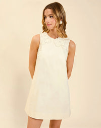 Juniper Shift Mini Dress in Ivory cotton poplin with 3D floral embroidered appliqué, sleeveless shift silhouette, crew neckline, and hidden pockets.