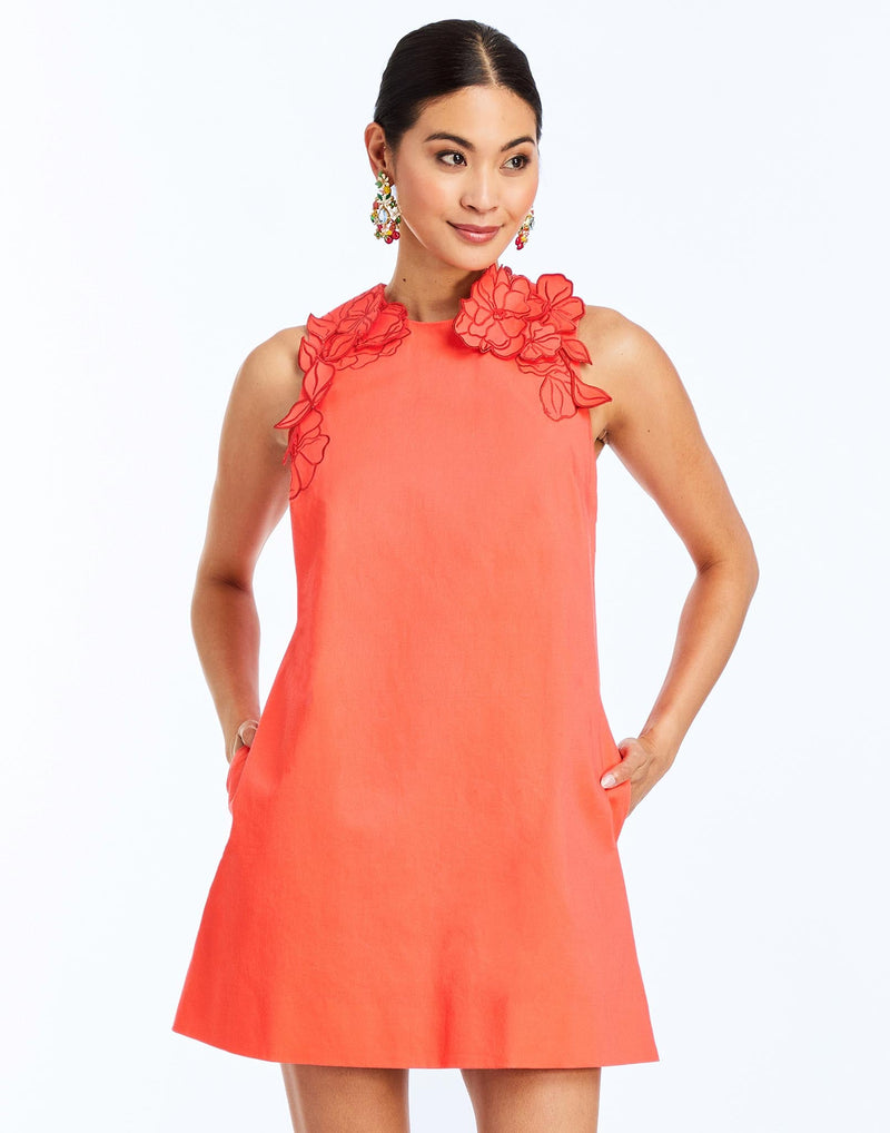 Front - Juniper Shift Mini Dress in Calypso Coral is an embroidered shift mini with scalloped floral appliqué and crew neckline.