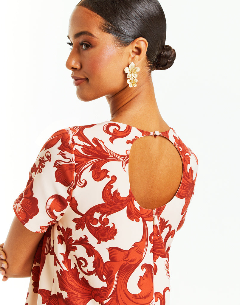 Ivory mini shift  dress with short sleeves and red floral print.