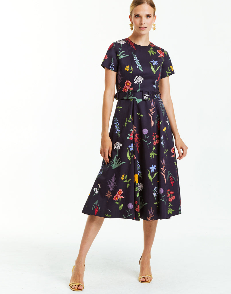 Cotton sateen sleeved cocktail midi dress in navy with bold floral print. 