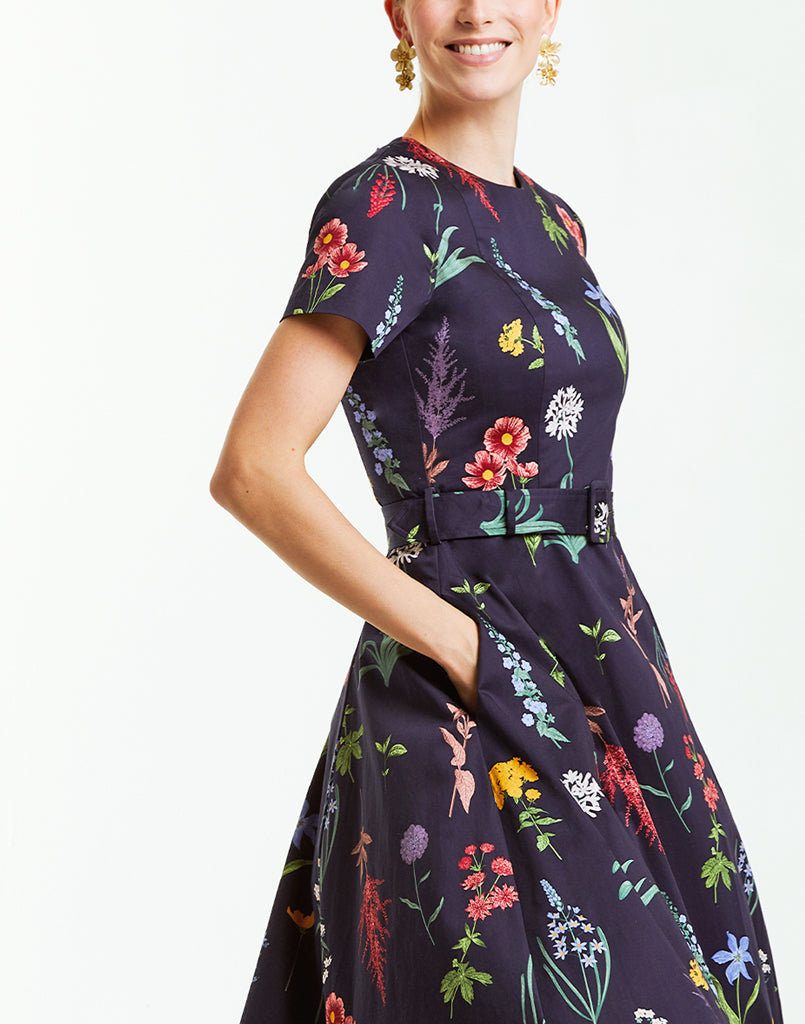 Cotton sateen sleeved cocktail midi dress in navy with bold floral print. 