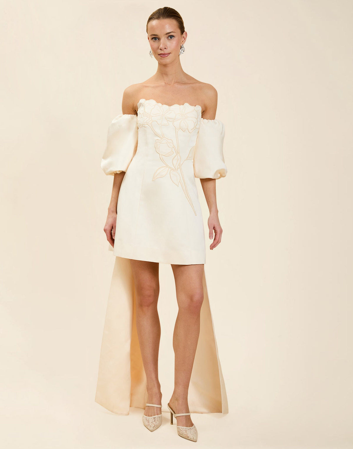 Liezel Convertible Mini Dress in Ivory taffeta with tonal floral embroidery, removable balloon sleeves, and detachable Watteau-style train.