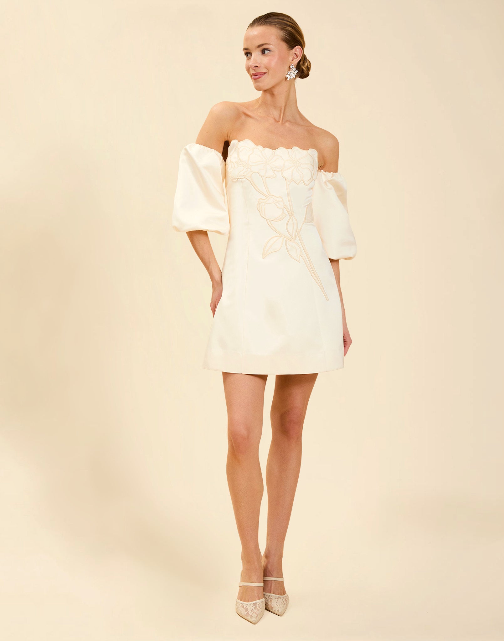 Liezel Convertible Mini Dress in Ivory taffeta with tonal floral embroidery, removable balloon sleeves, and detachable Watteau-style train.