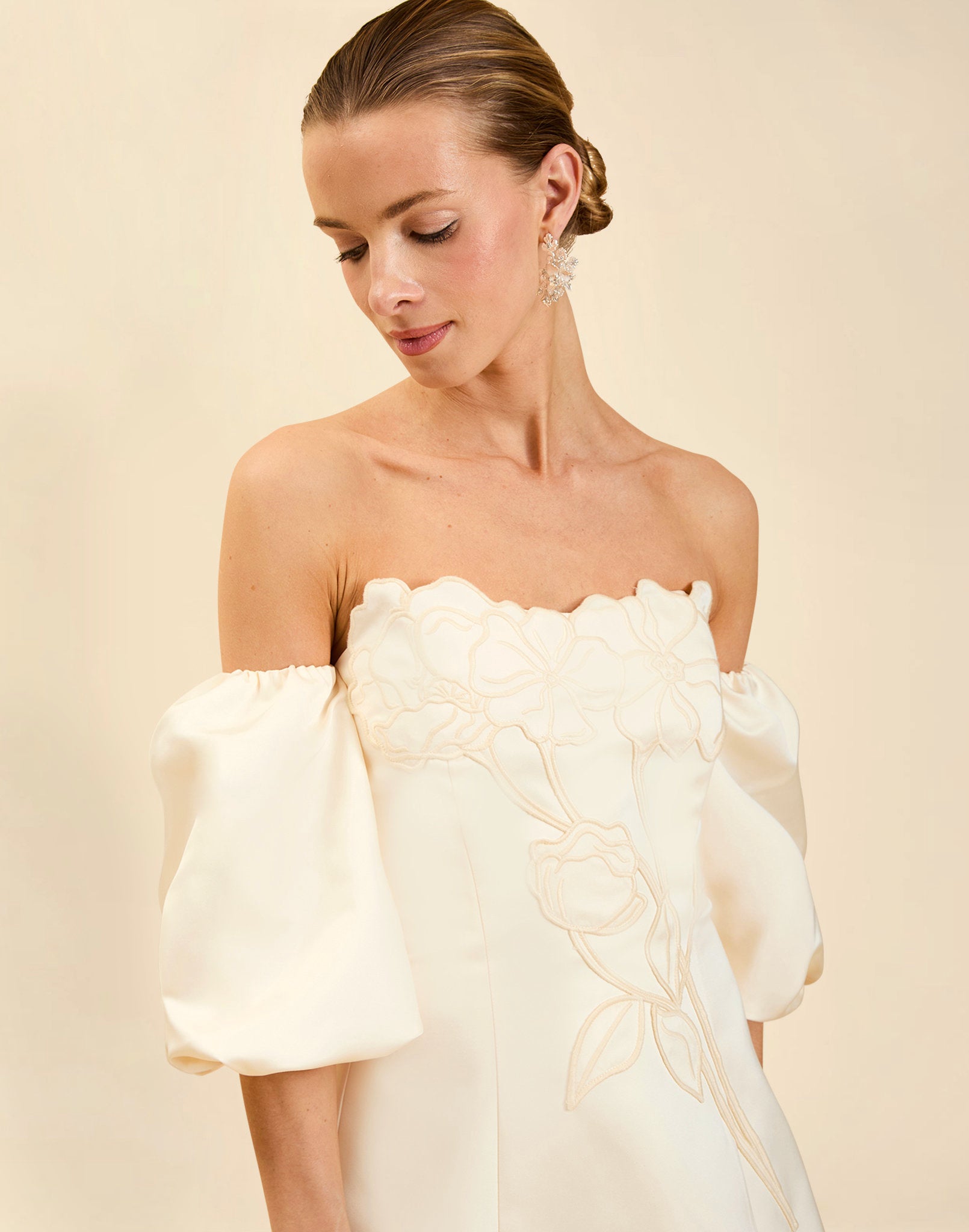 Liezel Convertible Mini Dress in Ivory taffeta with tonal floral embroidery, removable balloon sleeves, and detachable Watteau-style train.