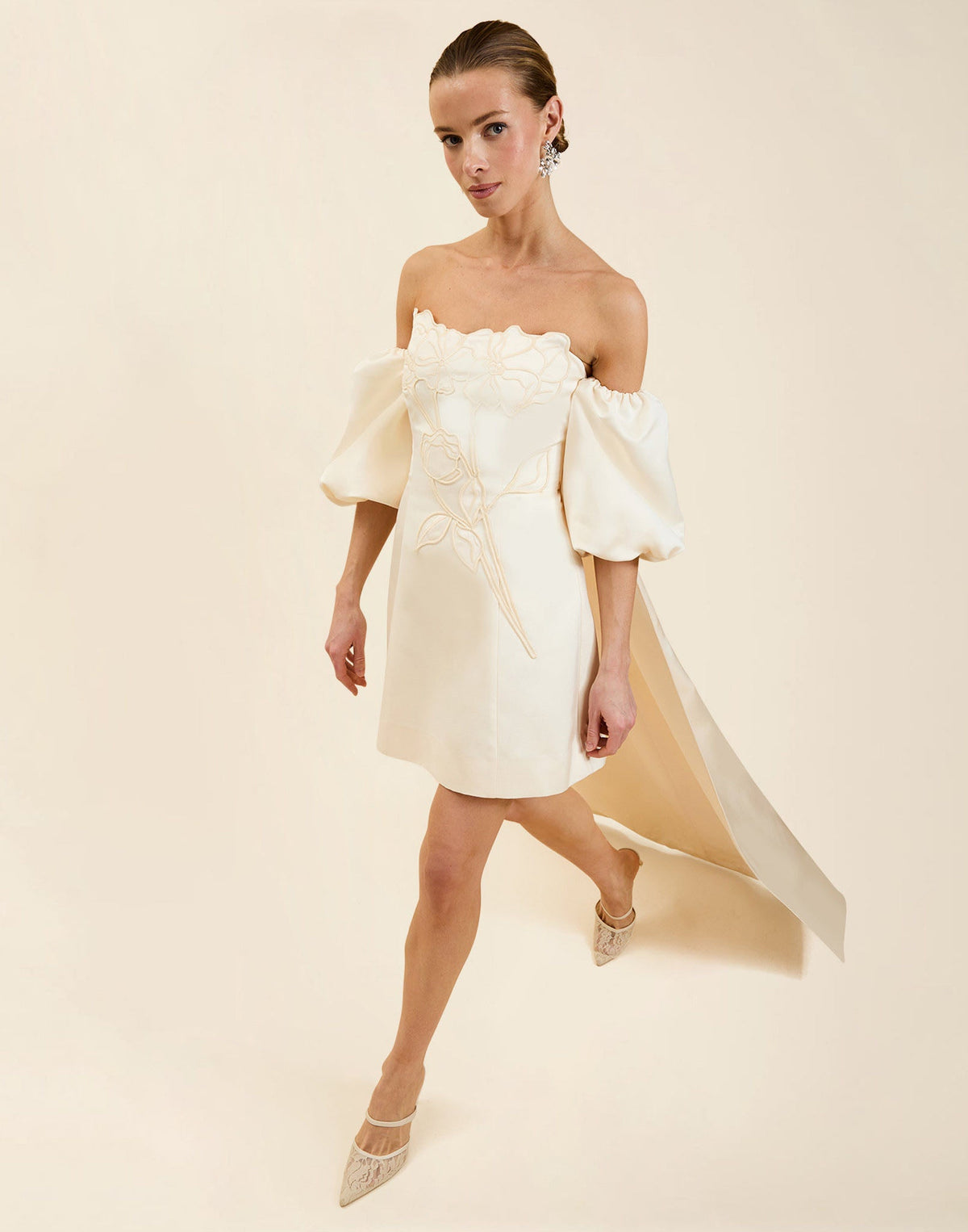 Liezel Convertible Mini Dress in Ivory taffeta with tonal floral embroidery, removable balloon sleeves, and detachable Watteau-style train.