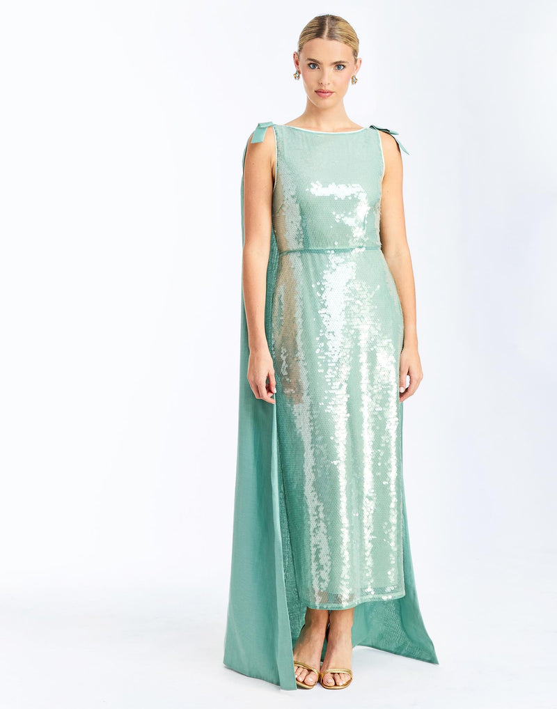 Front - Lillian Convertible Gown in Aquarelle Blue is a sequin column gown with removable cape and bow details.