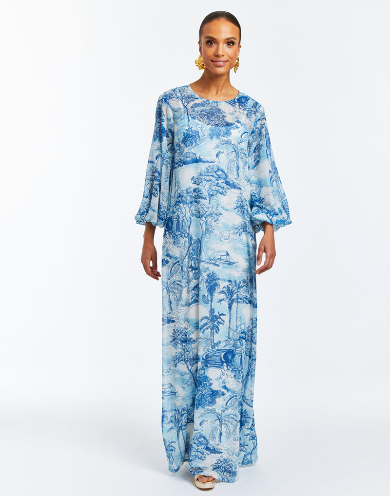 Blue and White toile printed maxi dress gown with sash tie at neck and blouson sleeves. 