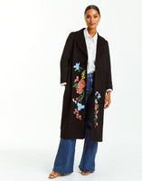 Black wool duster with floral embroidery.