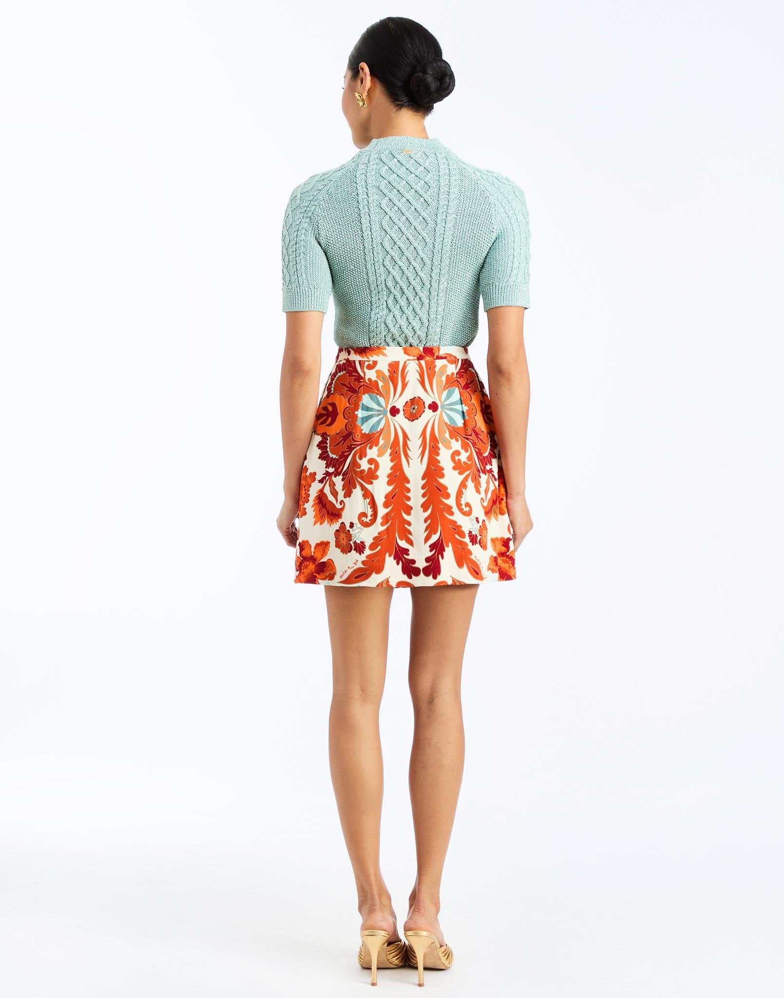 back - Mallory Mini Skirt in Rossa Waltz is an A-line printed mini skirt with waistband and pockets