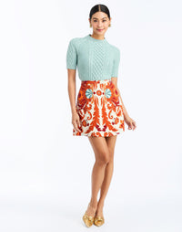 Front - Mallory Mini Skirt in Rossa Waltz is an A-line printed mini skirt with waistband and pockets