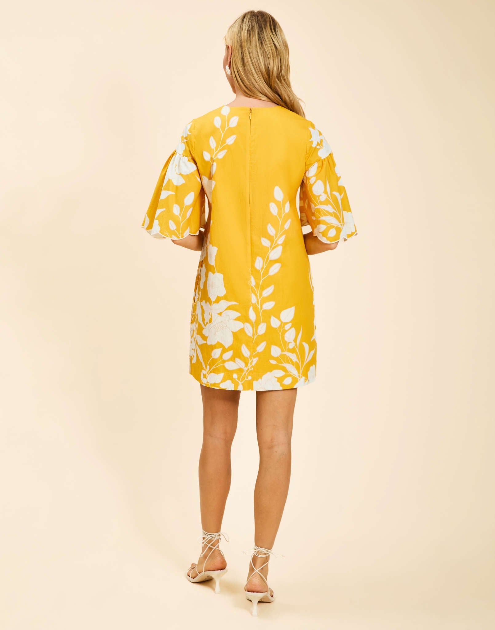 Marianna Shift Mini Dress in Huckleberry Yellow poplin with scalloped elbow-length sleeves, ruffle detail, and shift silhouette.