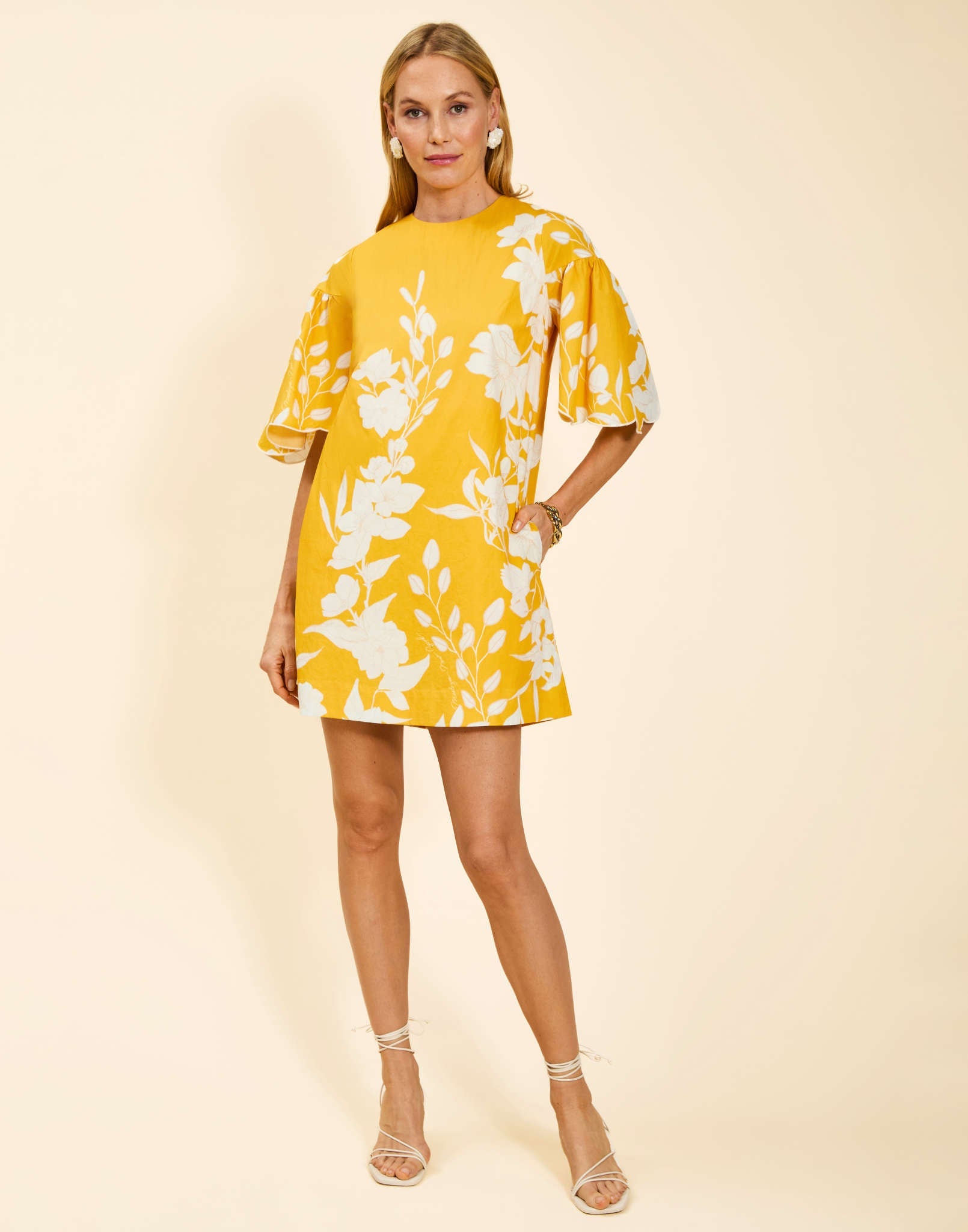 Marianna Shift Mini Dress in Huckleberry Yellow poplin with scalloped elbow-length sleeves, ruffle detail, and shift silhouette.