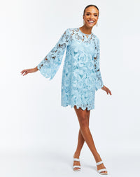 Laser-cut lace mini dress with scalloped hemline and full length bell sleeves.