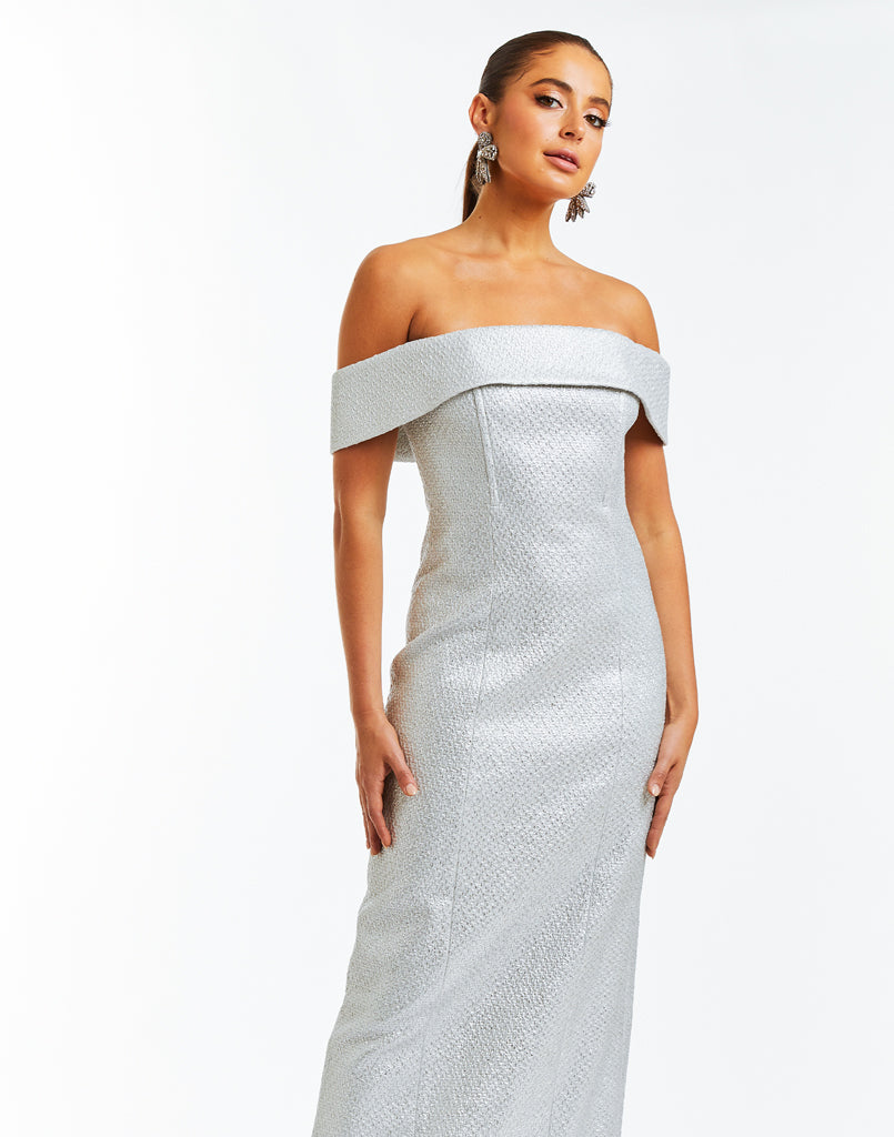 Metallic silver tweed fitted gown with off the shoulder sleeves and column silhouette. 