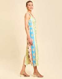 Monte Carlo Midi Dress in Beach Bazaar linen with scoop neckline, sleeveless silhouette, and bias panel skirt detail.