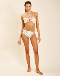 Model wearing Mykonos Halter Bikini Top in Garden Muse with ruched front detail and gold hardware.
