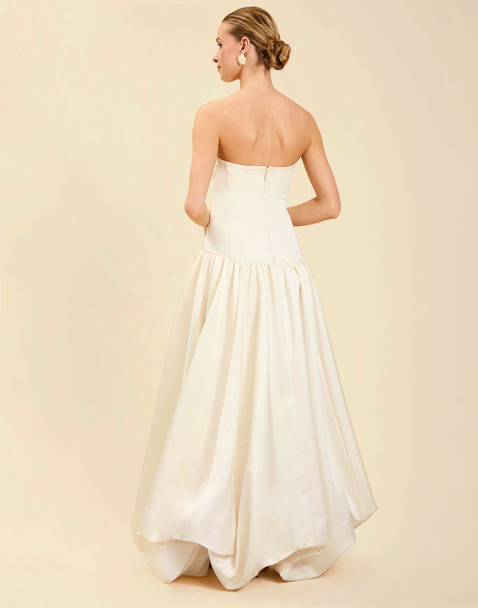 Nereida Dropwaist Gown in Ivory taffeta with strapless neckline, tonal floral embroidery, drop-waist silhouette, and high-low skirt with train.