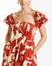ivory off the shoulder gown with red floral print. 