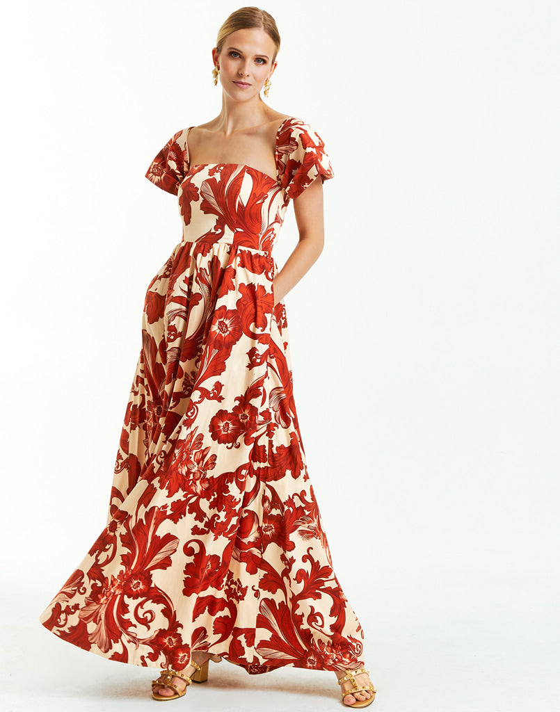ivory off the shoulder gown with red floral print. 