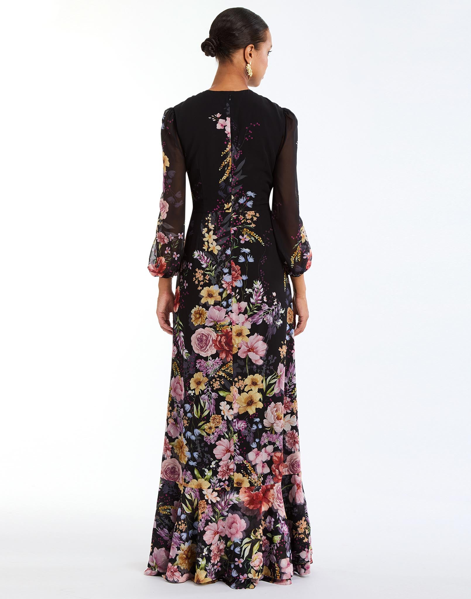 Ophelia Chiffon Gown in Twilight Florals back – chiffon evening gown with twisted keyhole neckline, sheer balloon sleeves, and cascading ruffle skirt by Mestiza New York.