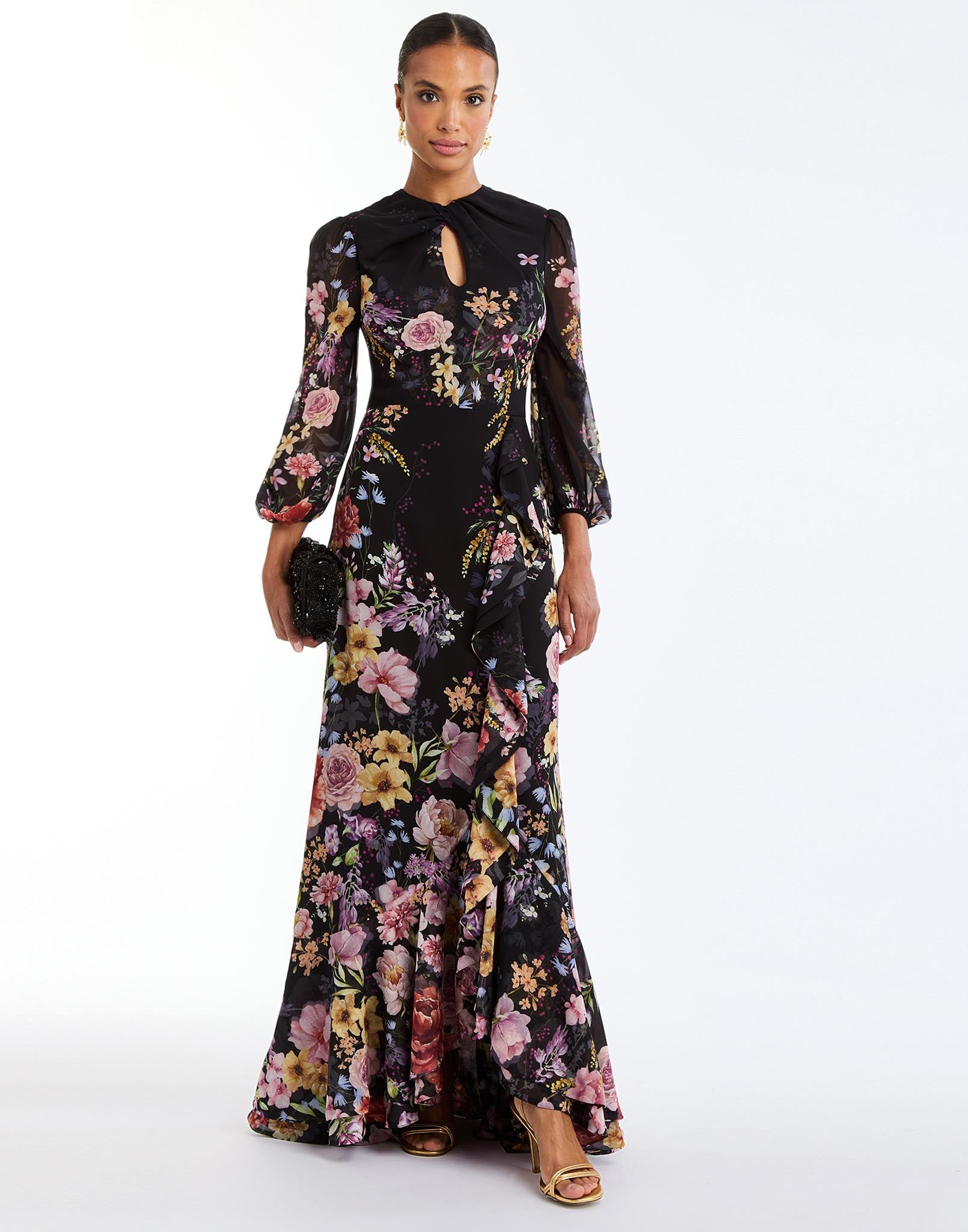 Ophelia Chiffon Gown in Twilight Florals front – chiffon evening gown with twisted keyhole neckline, sheer balloon sleeves, and cascading ruffle skirt by Mestiza New York.