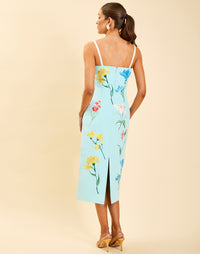 Pacifica Midi Dress in Blue Waltz moire with hand-sewn floral embroidery, peek-a-boo neckline, boned bodice, and side pockets.