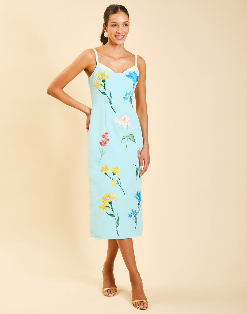Pacifica Midi Dress in Blue Waltz moire with hand-sewn floral embroidery, peek-a-boo neckline, boned bodice, and side pockets.