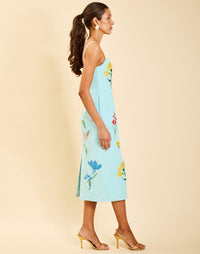 Pacifica Midi Dress in Blue Waltz moire with hand-sewn floral embroidery, peek-a-boo neckline, boned bodice, and side pockets.