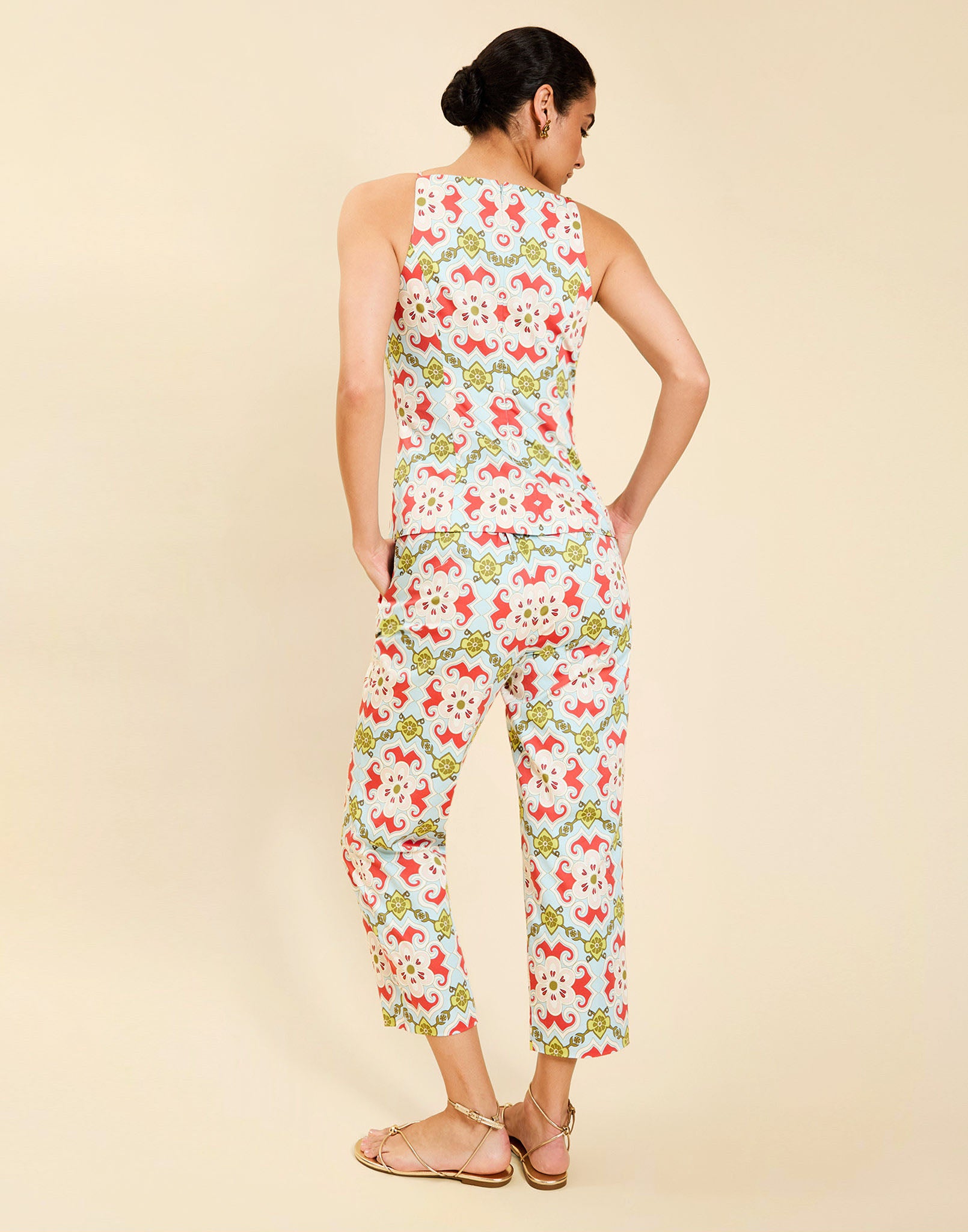 Model wearing the Palau Cigarette Pant in Quatrefoil Sierra print, featuring a slim-fit cropped silhouette, tailored front pleat detailing, side seam pockets, and crisp poplin fabrication.