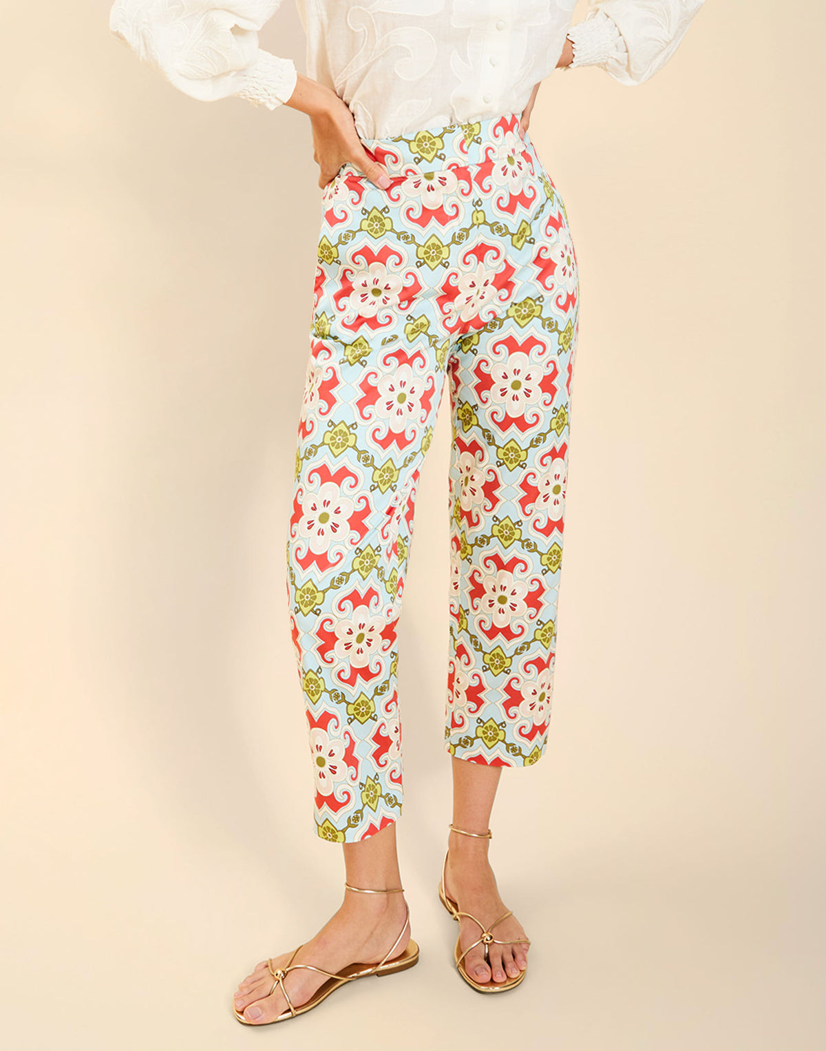 Model wearing the Palau Cigarette Pant in Quatrefoil Sierra print, featuring a slim-fit cropped silhouette, tailored front pleat detailing, side seam pockets, and crisp poplin fabrication.